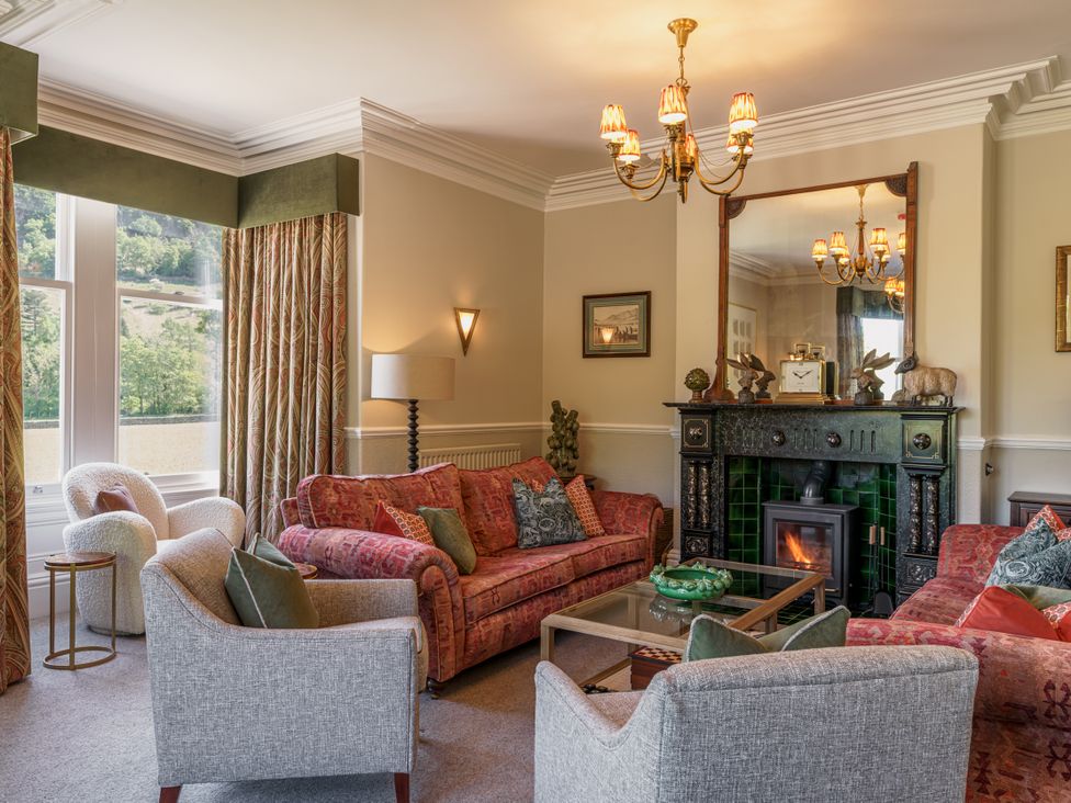 A living room with sofa and armchairs at Leathes Head Country House Borrowdale near Keswick