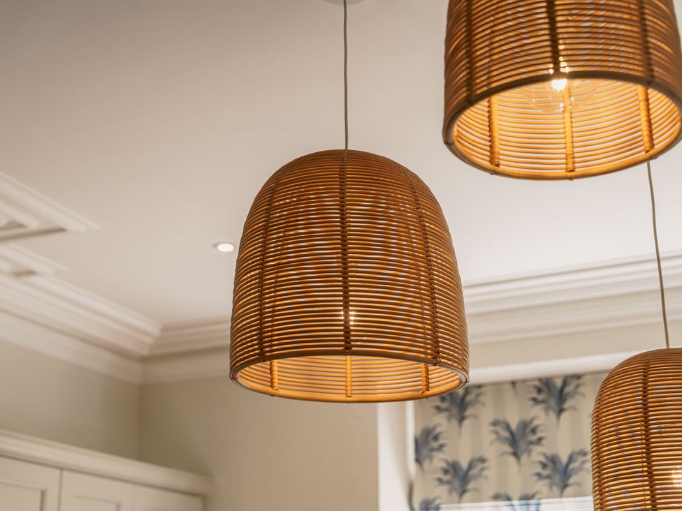 A kitchen with hanging light fixtures at Leathes Head Country House in Borrowdale near Keswick