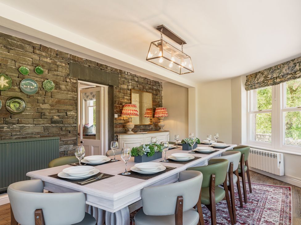 A dining room with a large table and chairs at Leathes Head Country House in Borrowdale near Keswick