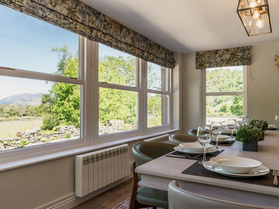 A dining room with a table set for dinner at Leathes Head Country House Borrowdale near Keswick
