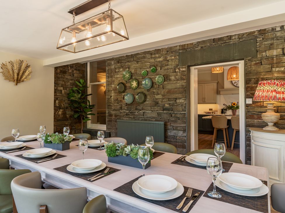 A dining room with a long table set for a meal at Leathes Head Country House Borrowdale near Keswick