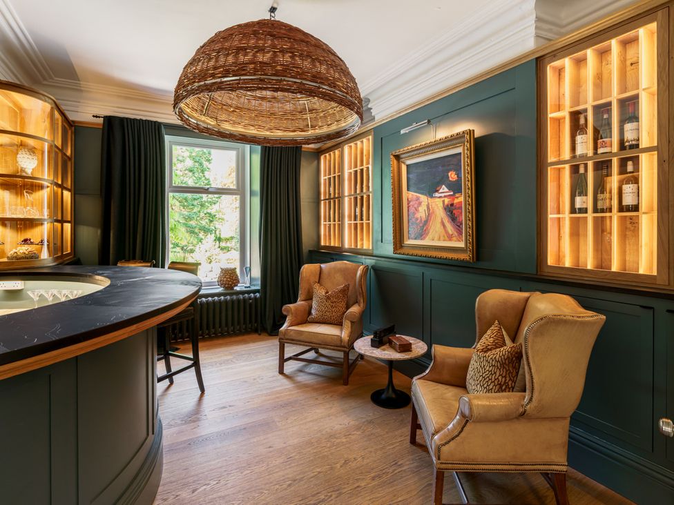 A bar area with seating and shelves at Leathes Head Country House, Borrowdale near Keswick
