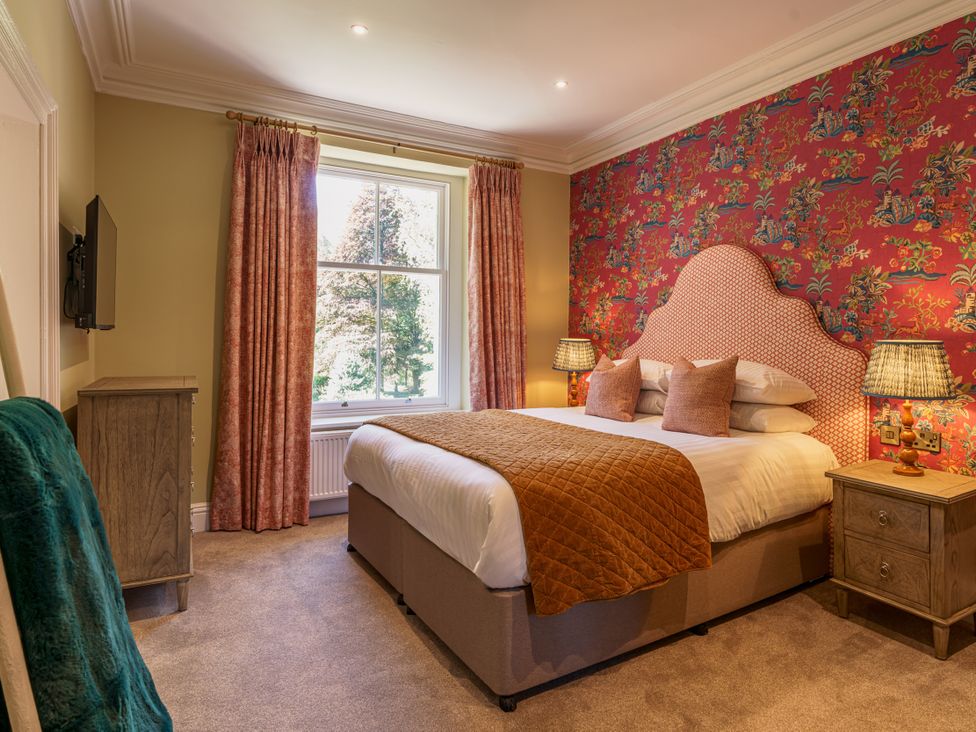 A bedroom with a bed and bedside table at Leathes Head Country House Borrowdale near Keswick