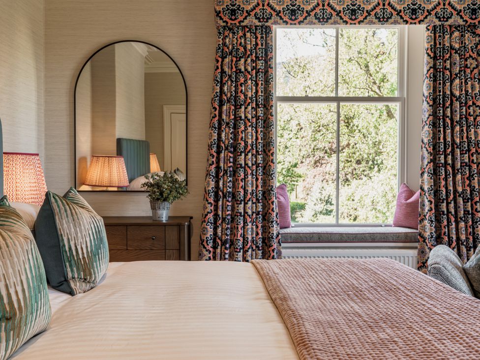 A bedroom with a bed and window at Leathes Head Country House in Borrowdale near Keswick