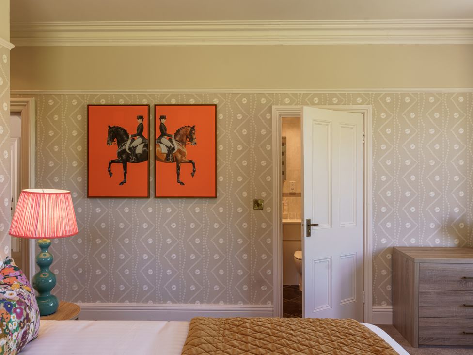 A bedroom with artwork on the wall at Leathes Head Country House Borrowdale near Keswick