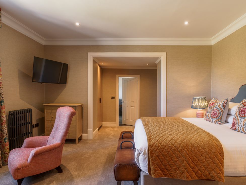 A bedroom with a bed and television at Leathes Head Country House in Borrowdale near Keswick