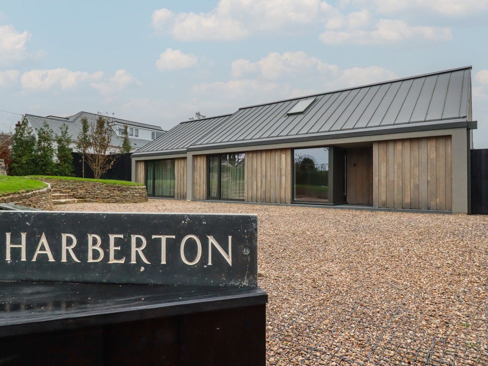 A house with a sign in front at Harberton