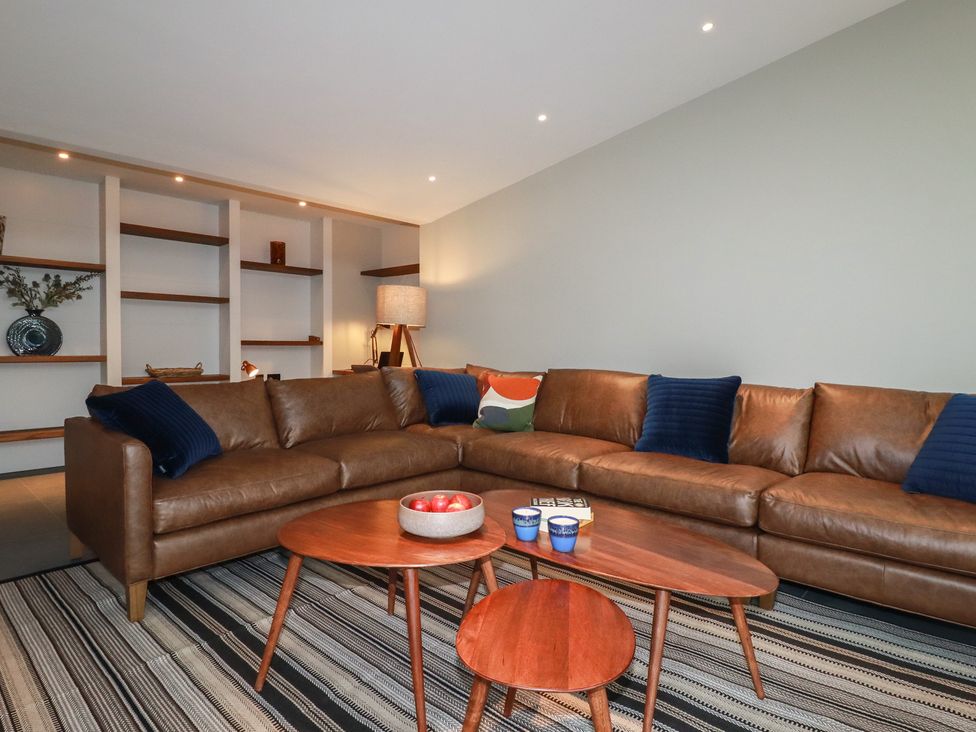 A living room with a sofa and a coffee table at Harberton