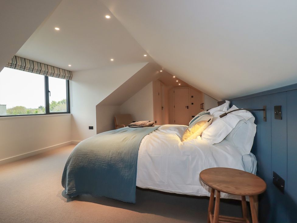 A bedroom with a bed and a window at Harberton in 