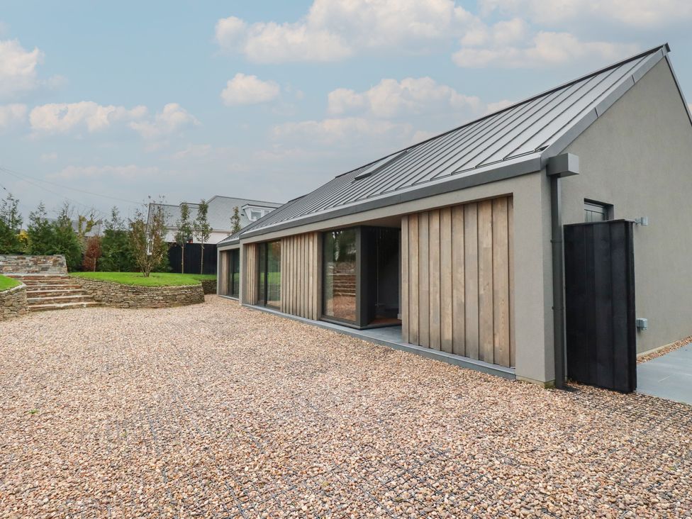 An exterior view of a house with gravel driveway at Harberton