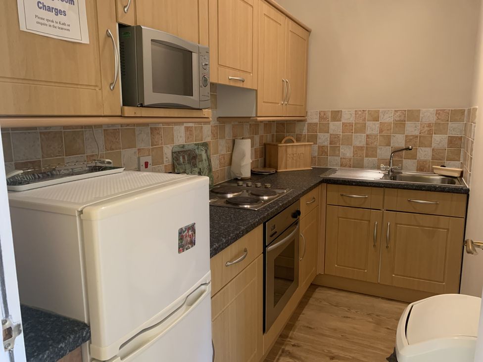 A kitchen with appliances and storage at The Hayloft near Wigton