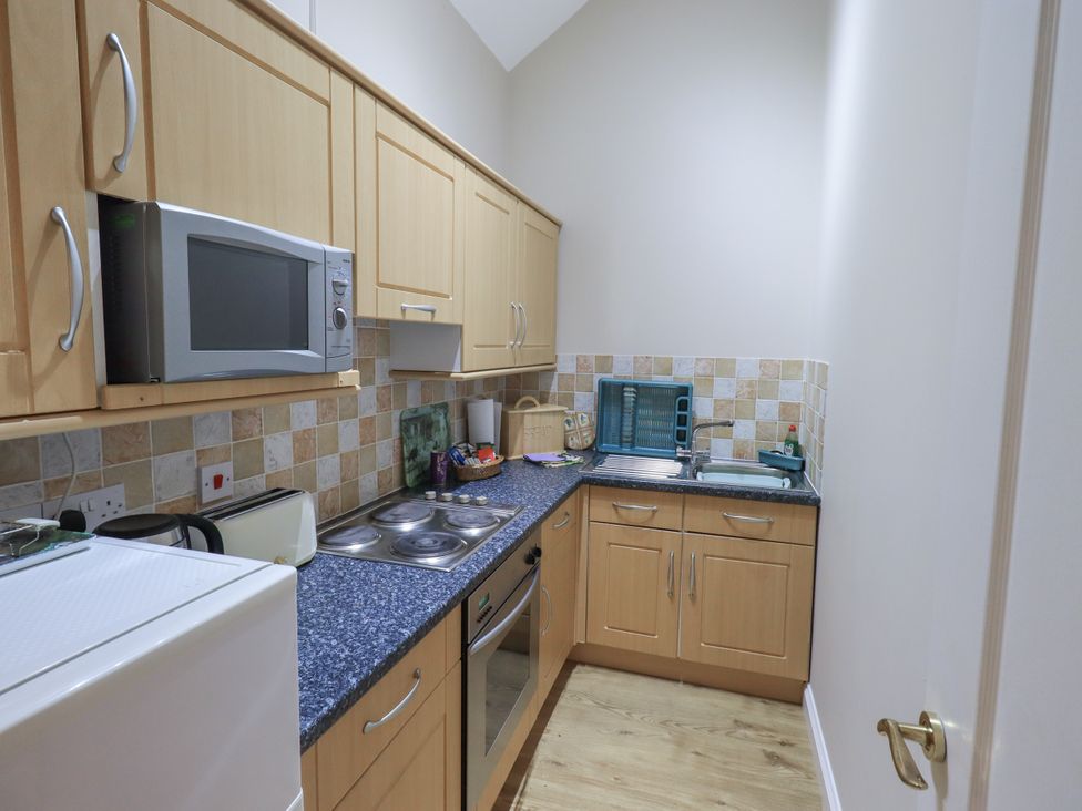 A kitchen with cabinets and appliances at The Hayloft near Wigton