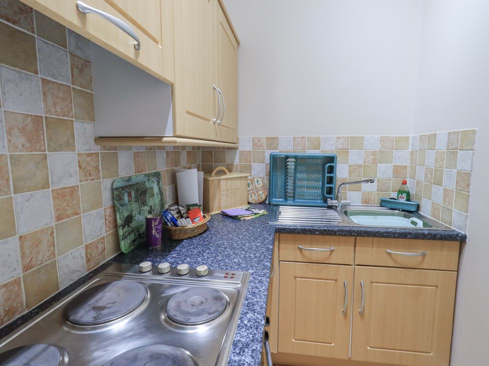 A kitchen with stove and sink at The Hayloft near Wigton