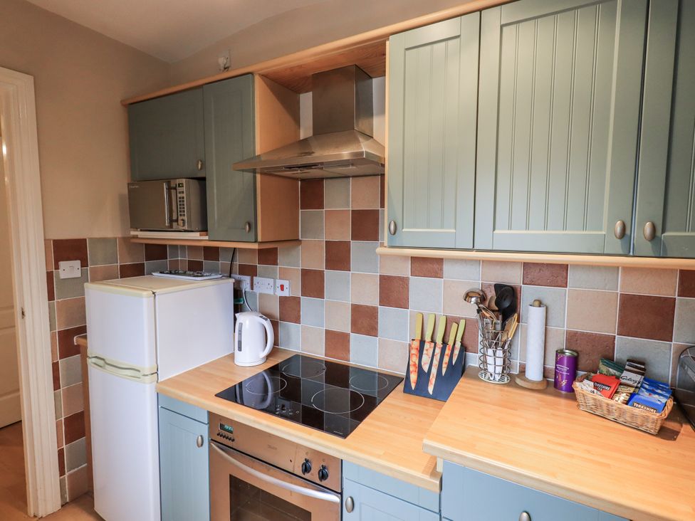 A kitchen with appliances and utensils at The Coach House near Wigton