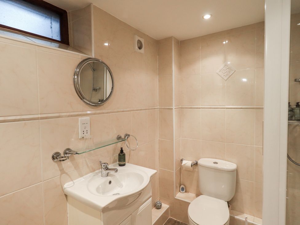 A bathroom with sink and toilet at The Coach House near Wigton