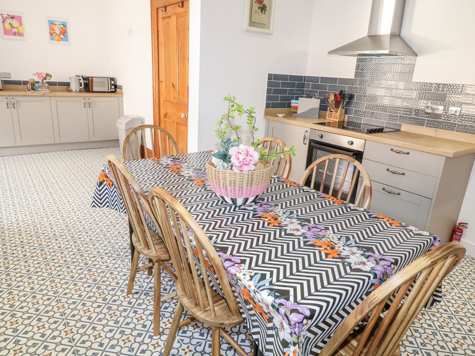 A kitchen with a dining table and chairs at 4 South Park in Lincoln