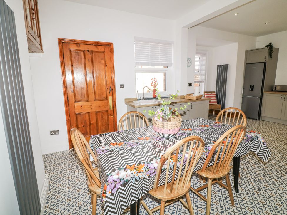 A kitchen with a table and chairs at 4 South Park in Lincoln