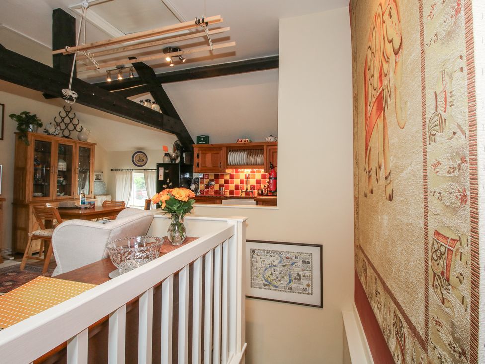 A kitchen with dining table and chairs at Heribert Cottage Shrewsbury