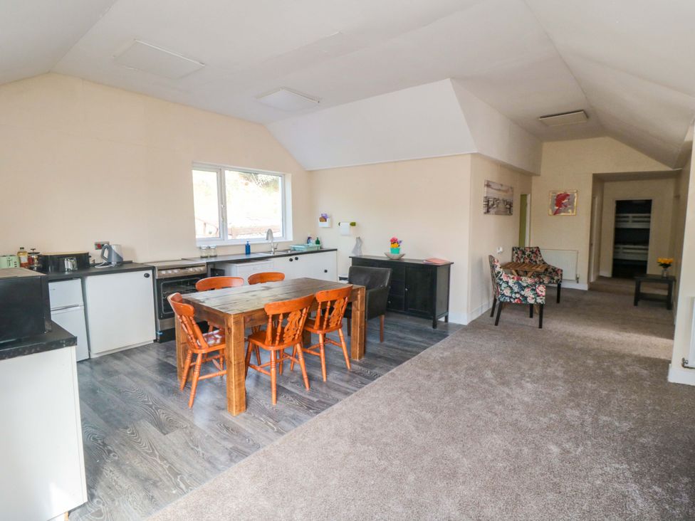 A kitchen with dining table and chairs at Grove Stables House in Yarm