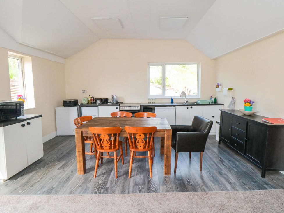 A kitchen with a dining table and chairs at Grove Stables House in Yarm