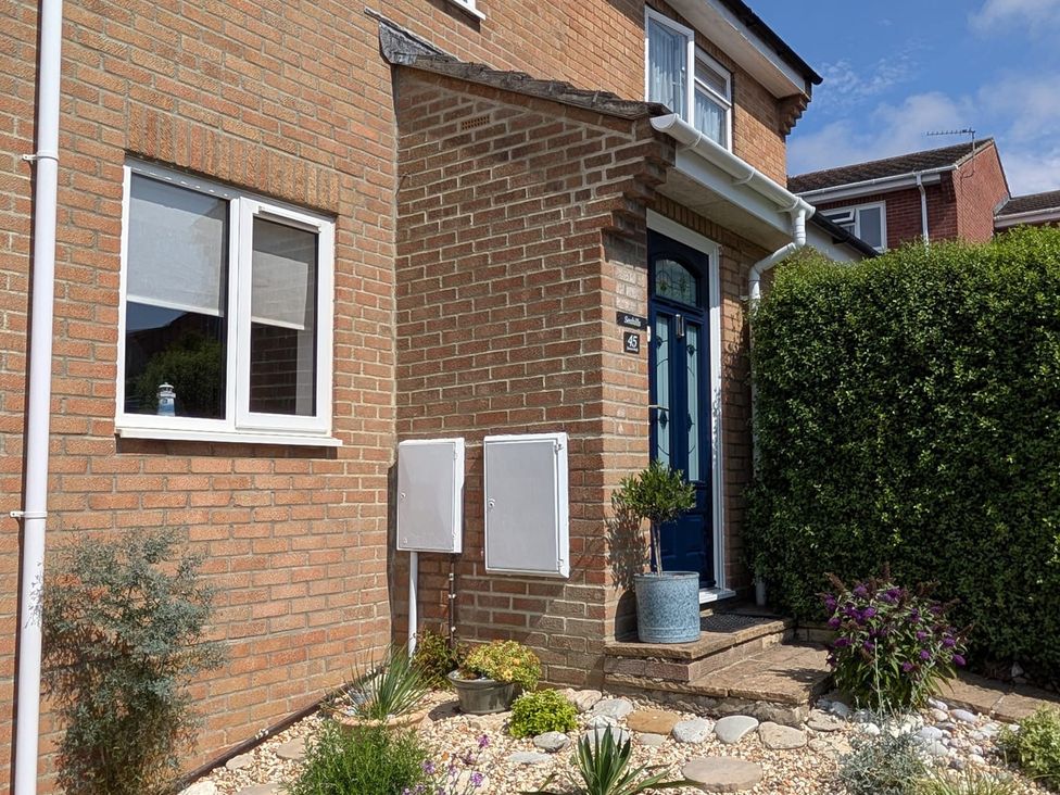 A front entrance with a door and plants at Seahills in Lyme Regis
