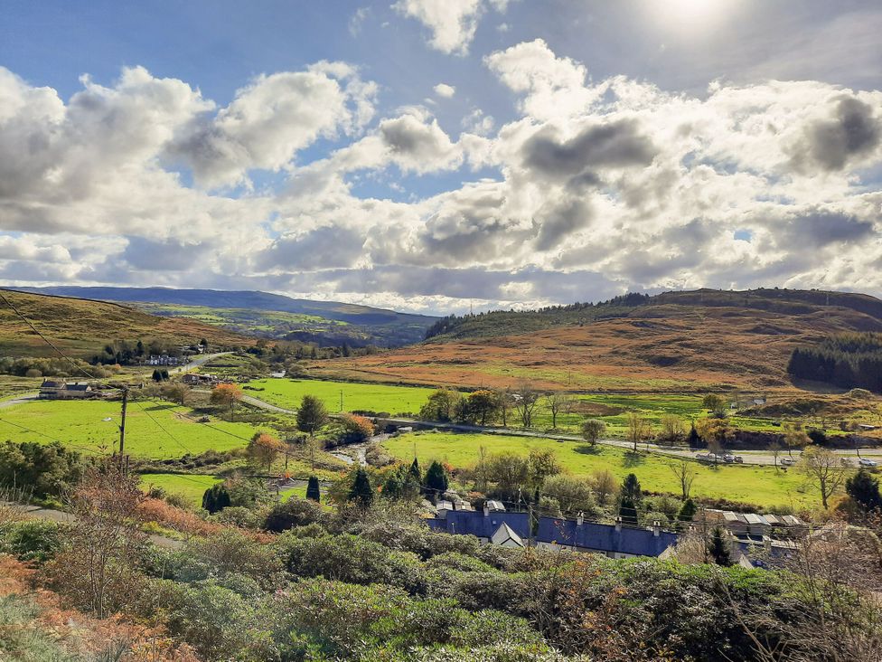 A landscape view of fields and hills at Waterfall Retreat in Blaenau Ffestiniog