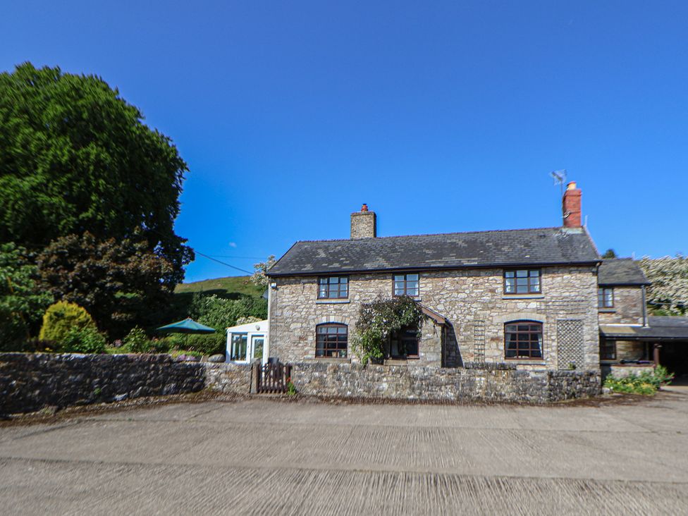 A house with trees and a driveway at Cynynion Uchaf Rhydycroesau near Trefonen