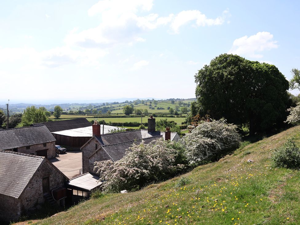 A view of houses and fields at Cynynion Uchaf in Rhydycroesau near Trefonen
