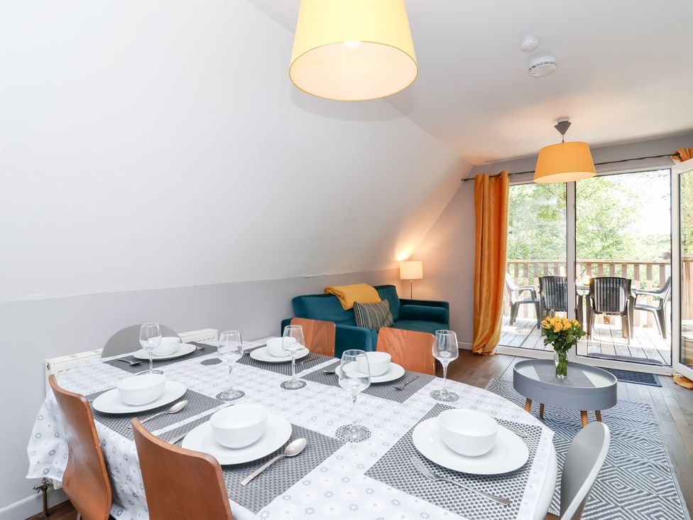 A dining room with a table set for dinner at Valley Lodge 37 St Ann's Chapel, Cornwall