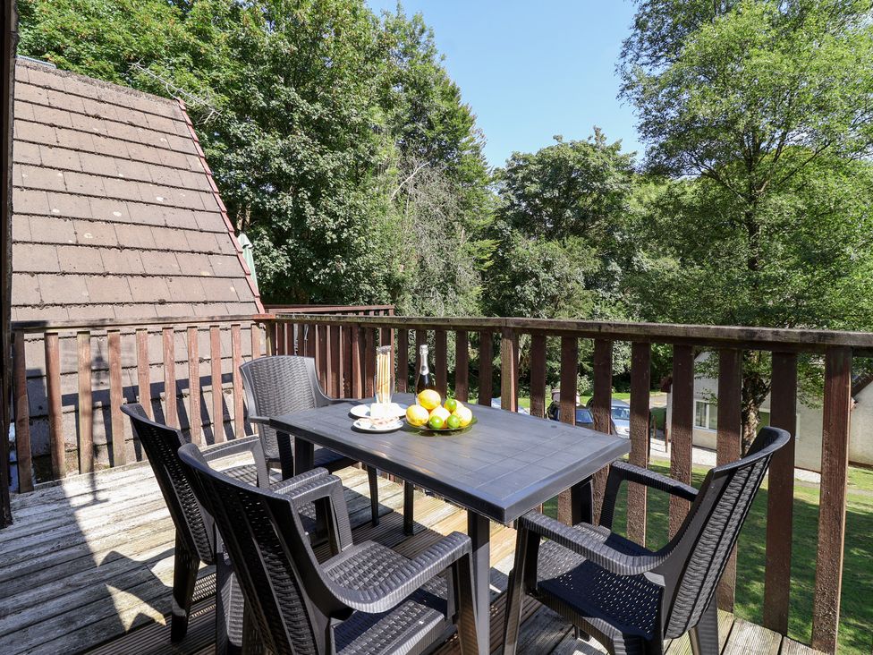 A patio with a table and chairs at Valley Lodge 37 St Ann's Chapel, Cornwall