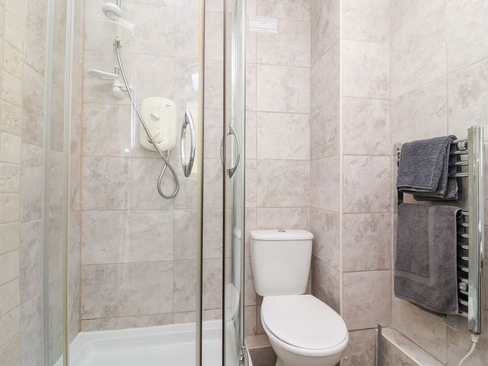 A bathroom with a shower and toilet at Valley Lodge 37 St Ann's Chapel Cornwall