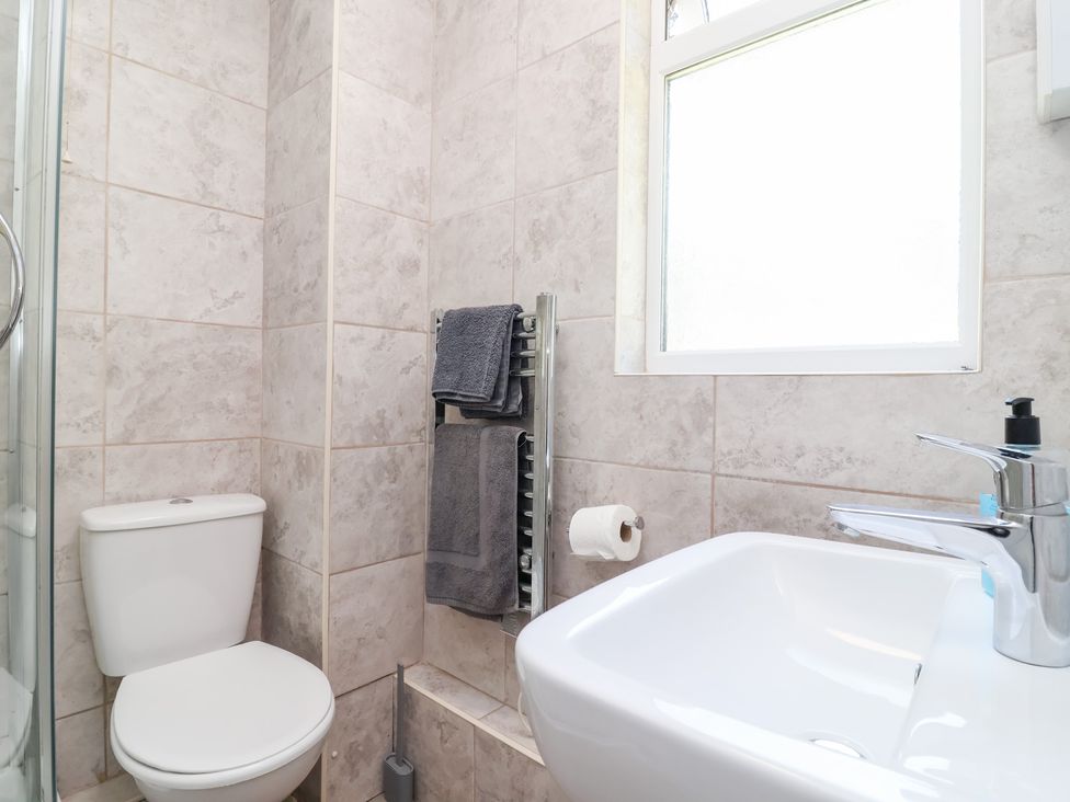 A bathroom with a toilet and sink at Valley Lodge 37 St Ann's Chapel, Cornwall