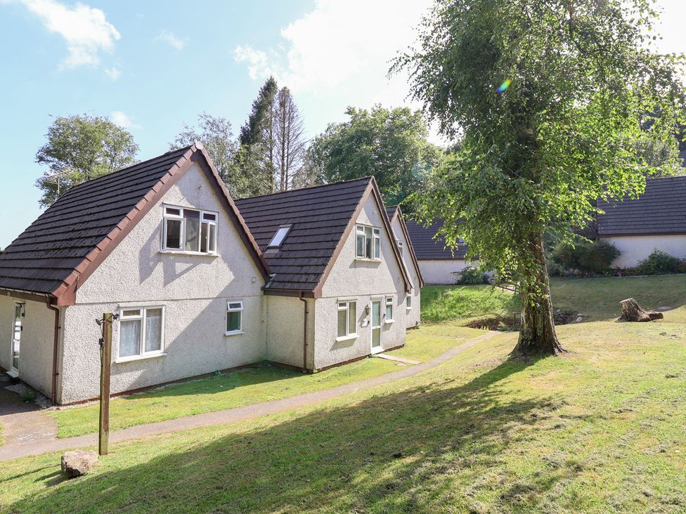 A house surrounded by grass and trees at Valley Lodge 37 St Ann's Chapel, Cornwall