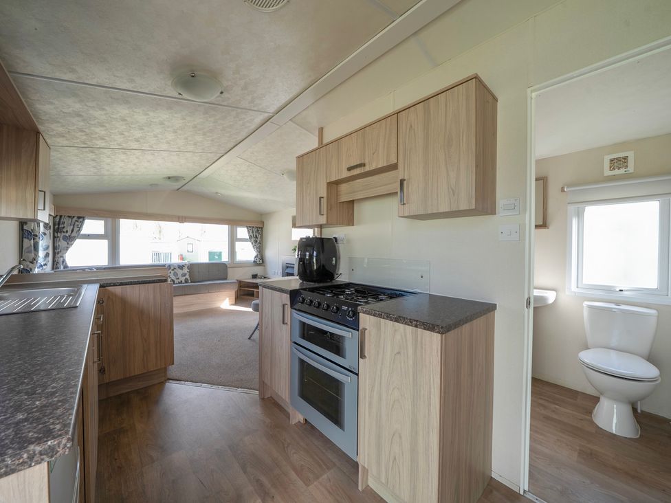 A kitchen featuring an oven and sink at Duckling Den - Billing Aquadrome