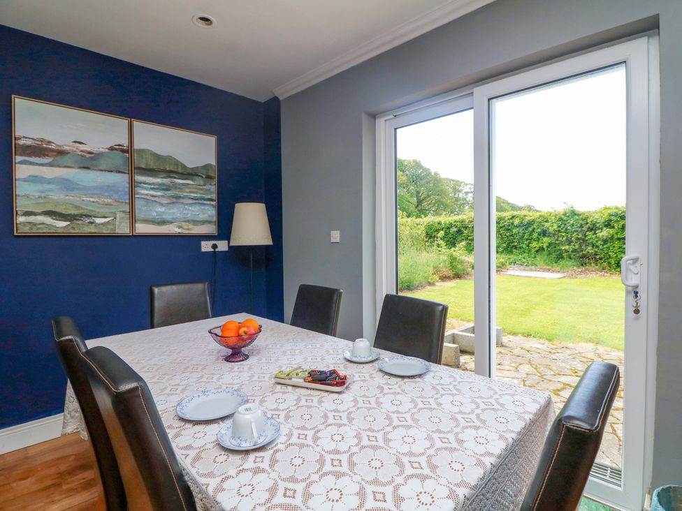 A dining room with a table set for tea at Beech Lodge, Foulksmills, County Wexford