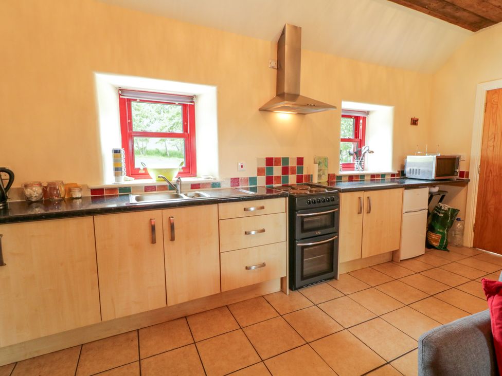 A kitchen with countertops and appliances at Shane's Cottage in Falcarragh, County Donegal