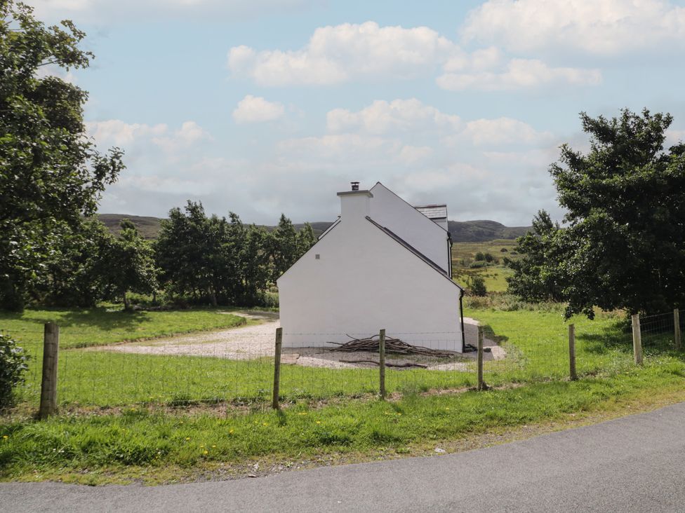 A house surrounded by grass and trees at Shane's Cottage, Falcarragh, County Donegal