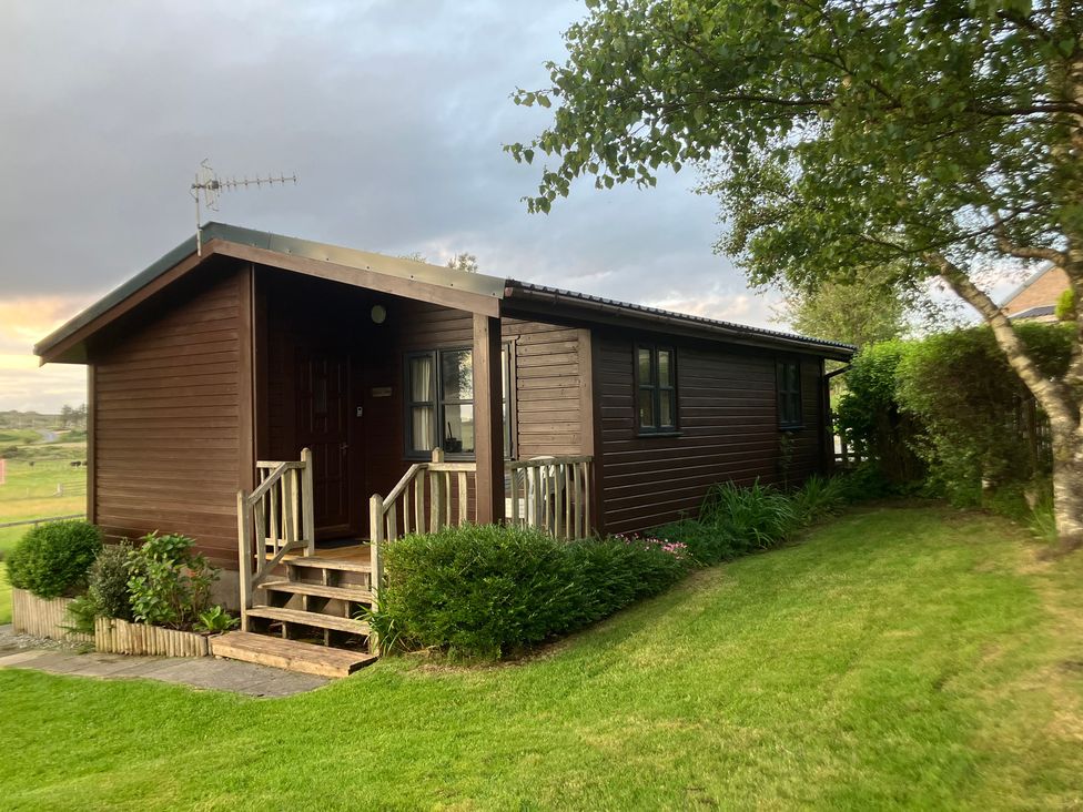 A cabin with steps and windows at Island View Lodge Back of Keppoch near Arisaig