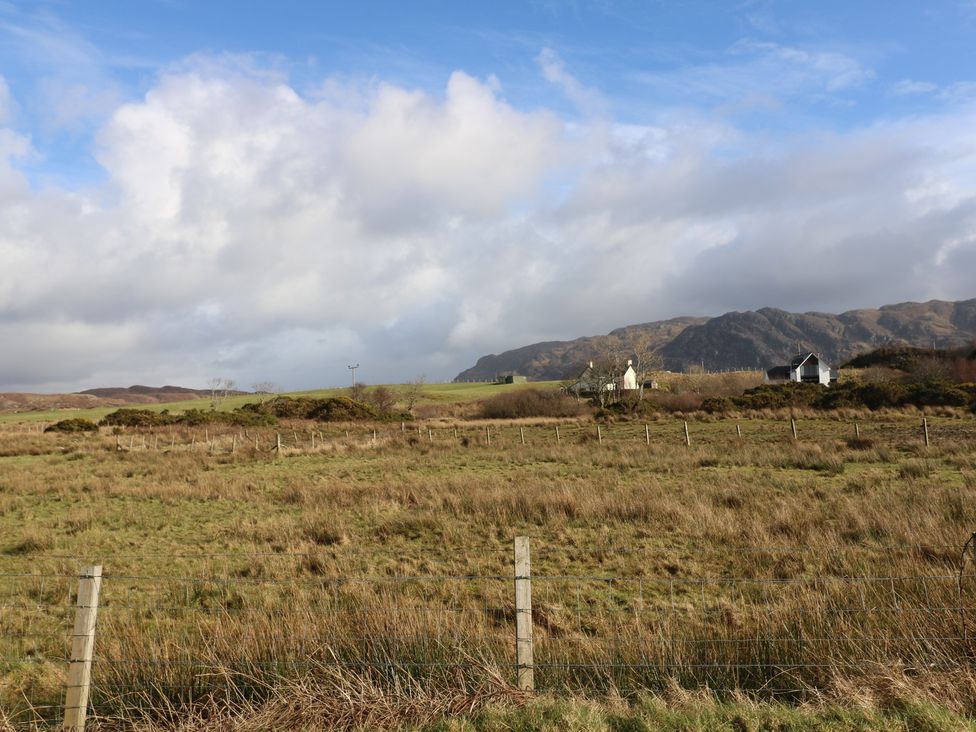 A landscape with a house and mountains at Island View Lodge Back of Keppoch near Arisaig