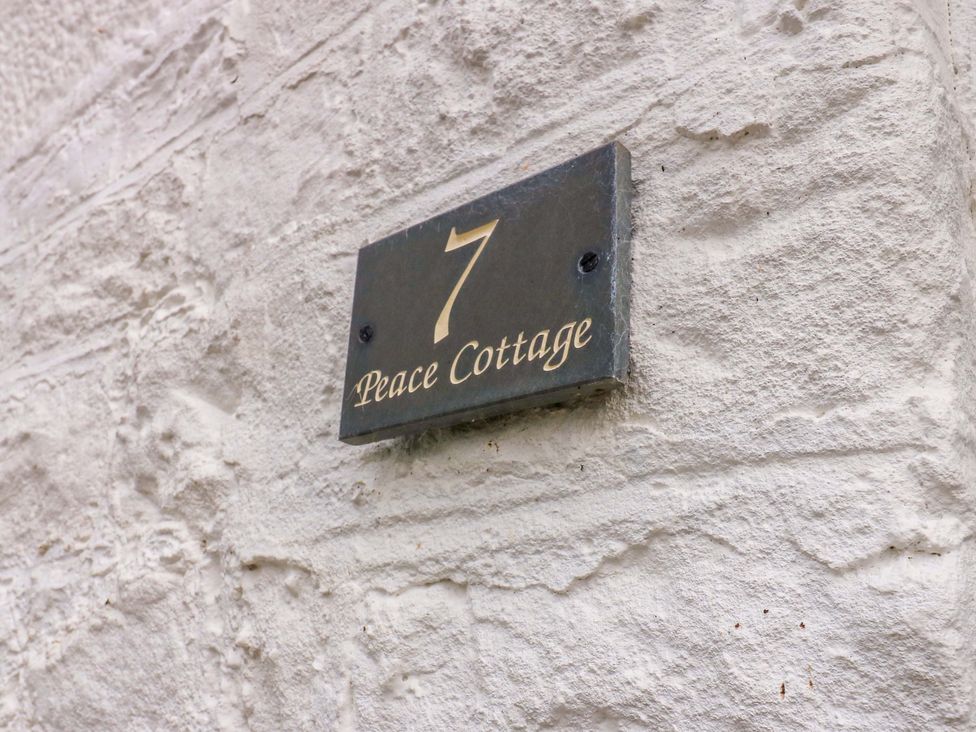 A house number and nameplate for Peace Cottage in Langton near Gainford