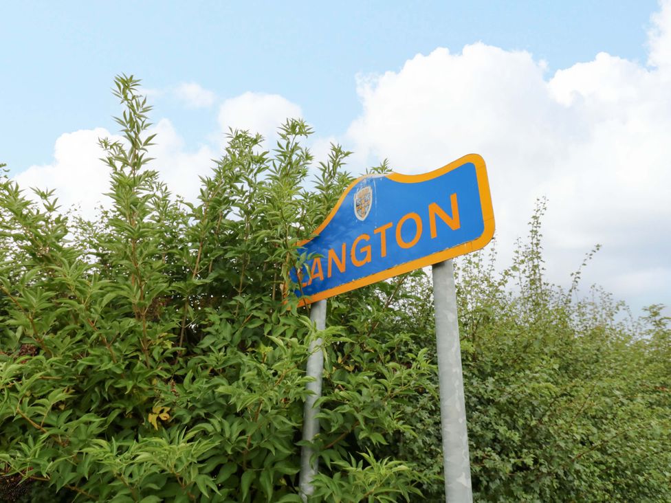 A road sign indicating Langton near Gainford