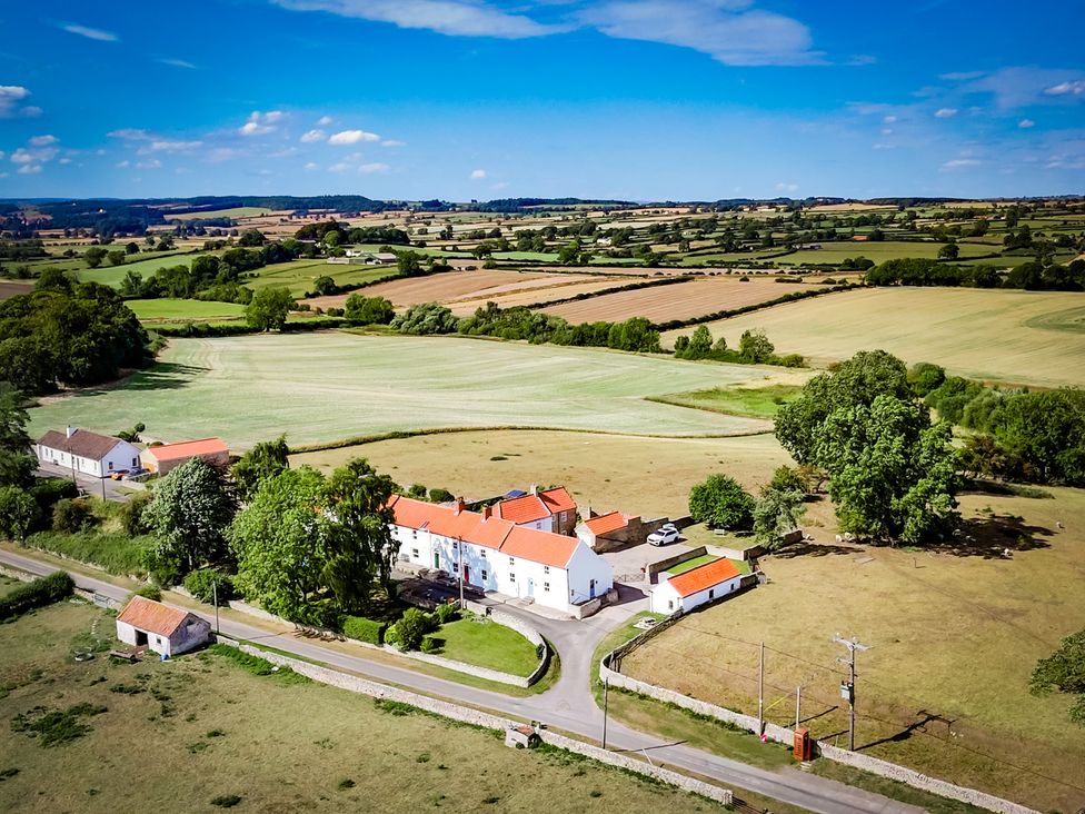 A scenic view of a house surrounded by fields at Peace Cottage in Langton near Gainford