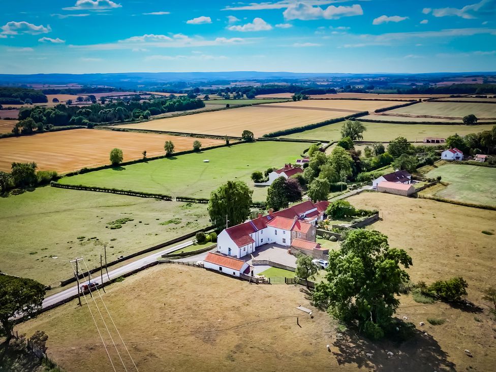 An aerial view of fields and houses at Peace Cottage in Langton near Gainford