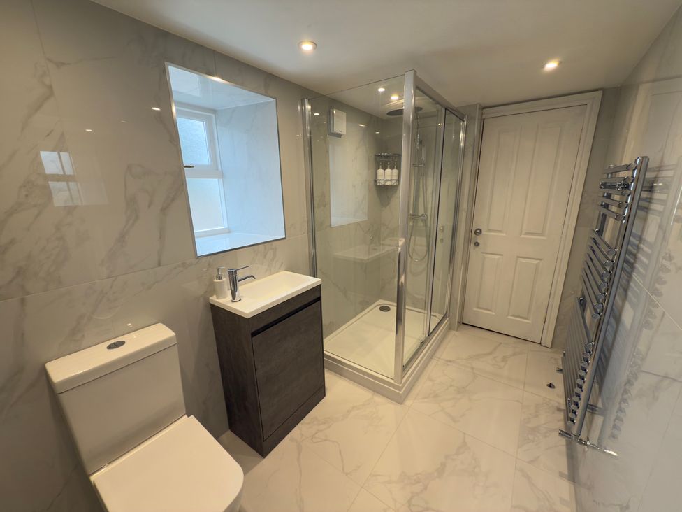 A bathroom with a shower and sink at Peace Cottage Langton near Gainford