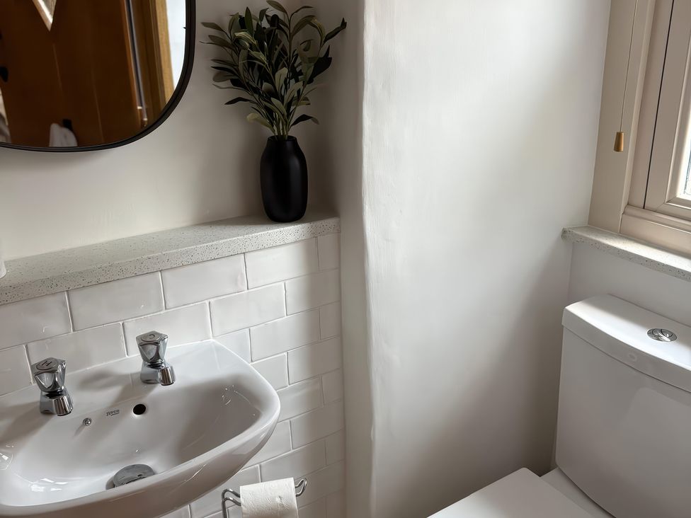 A bathroom featuring a sink and toilet at 12 Queen Street Keighley