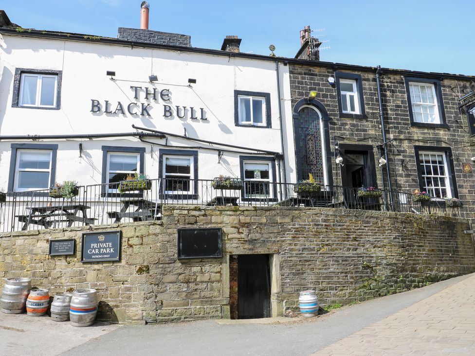 A pub building with signage at The Black Bull in Haworth
