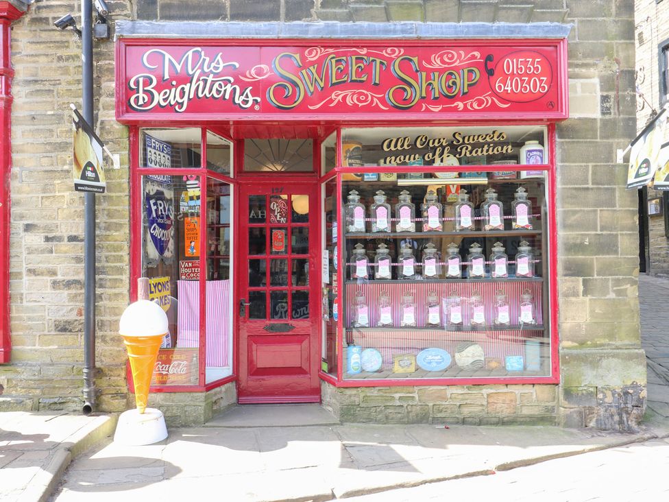 A storefront with a display of sweets at Mrs Beightons Sweet Shop in Haworth