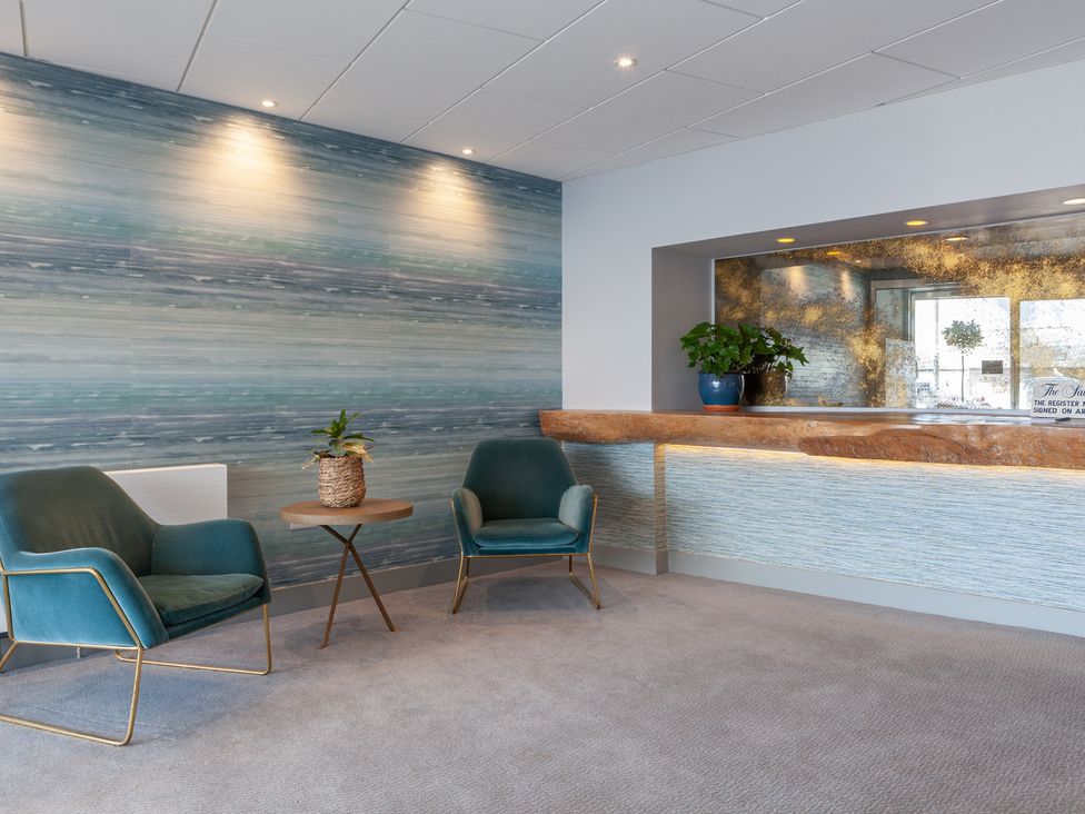 A reception area with chairs and a desk at 43 The Salcombe in Salcombe