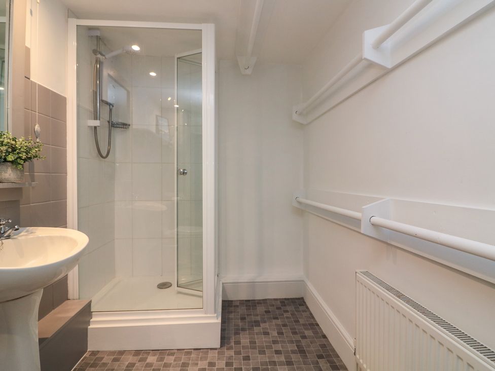 A bathroom with a shower and sink at 43 The Salcombe in Salcombe