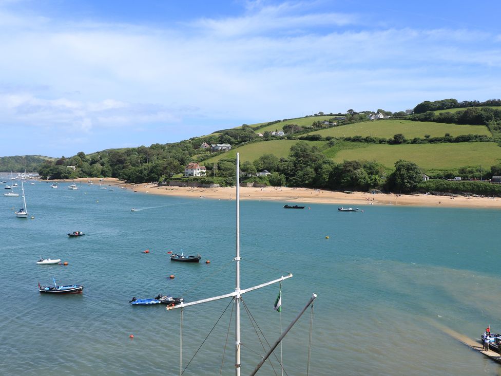A beach view with boats on the water at 43 The Salcombe in Salcombe